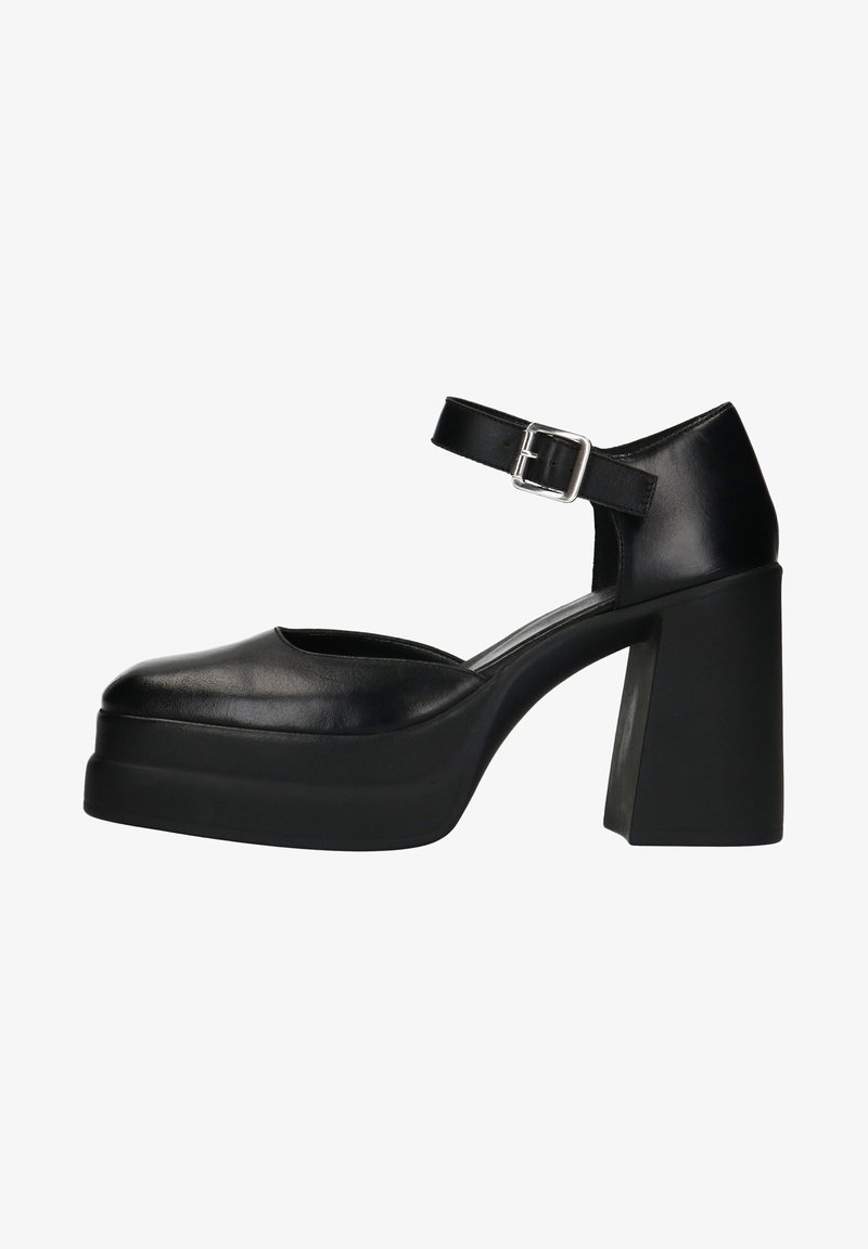 Chaussures à plateforme en cuir noir avec une bride de cheville, un talon carré, un bout arrondi et une texture lisse, présentant un design élégant et moderne.