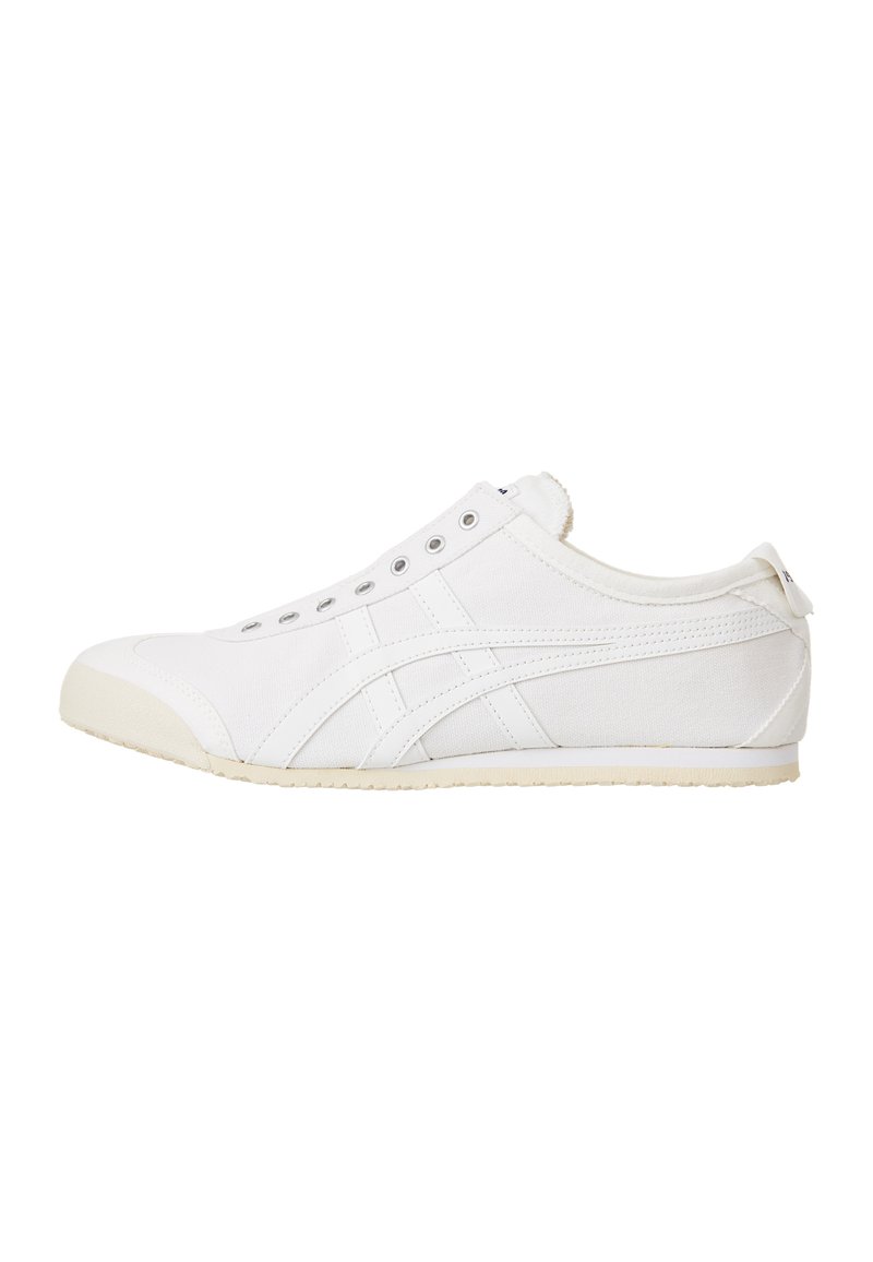 White canvas sneaker with a low profile, rounded toe, and rubber sole. Features a lace-up design and logo on the back.