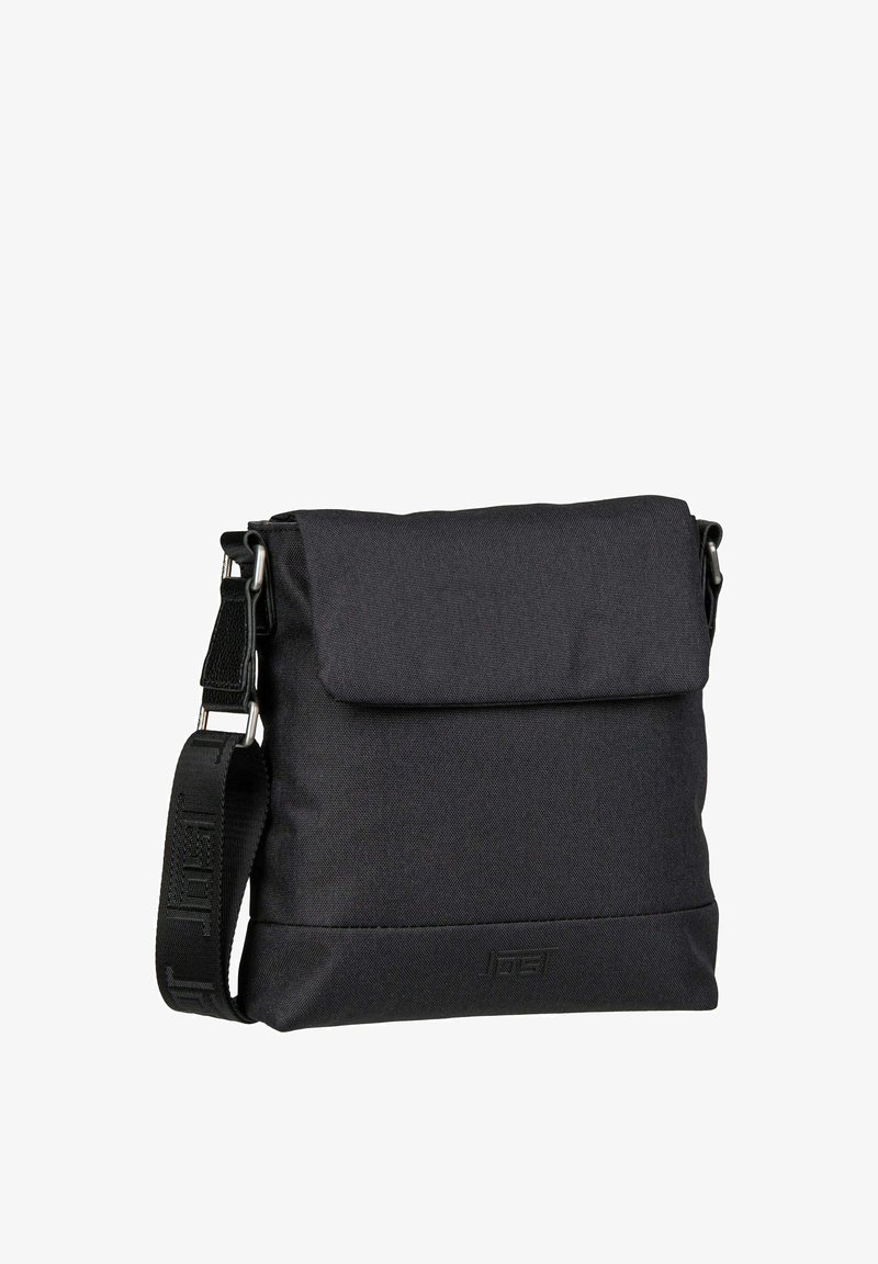 Black fabric crossbody bag with a fold-over flap, adjustable strap, and embossed logo on the front. Features a smooth, textured surface.