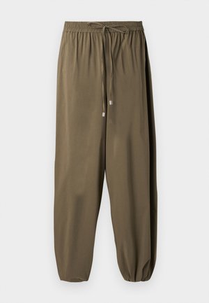 Pantalon ample vert olive avec taille élastique, cordon de serrage et bas resserrés aux chevilles.