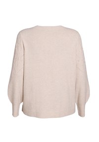Light beige knitted sweater with long balloon sleeves featuring diamond cut-out patterns. Ribbed hem and soft texture.