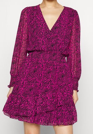Pink and black zebra print dress, sheer fabric, V-neck, long sleeves, elastic waist, ruffled hem, textured with a slight sheen.