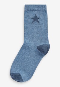 Blå strumpor i stickad tyg, med ett mörkare blått stjärnmönster på sidan, och ett förstärkt tå- och mudddesign.