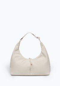 Sac à bandoulière en nylon beige avec une forme arrondie, une seule bandoulière et une fermeture éclair en haut. Texture douce et design minimaliste.