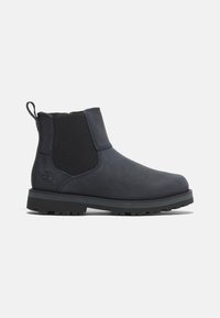 Bottine en cuir bleu marine foncé avec panneaux latéraux élastiques, languette au talon et épaisse semelle crantée en caoutchouc, montrée en profil latéral.