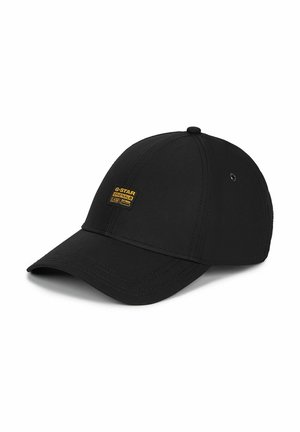Casquette de baseball noire avec une visière incurvée et un petit écusson jaune rectangulaire avec le logo G-Star Originals sur le panneau avant.
