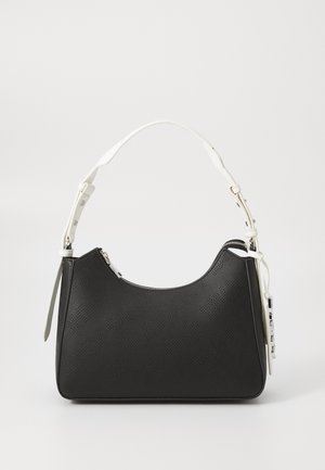 Black handbag with a textured finish, curved shape, and a white adjustable shoulder strap. Features a zip closure and decorative hardware.