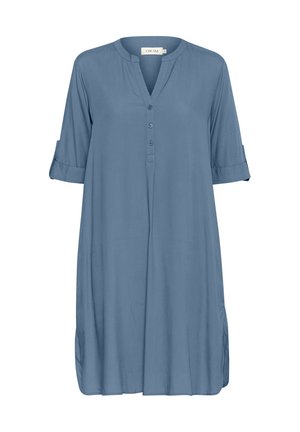 Blue, knee-length dress with a buttoned V-neck, rollable sleeves, soft texture, and side slits for ease of movement.