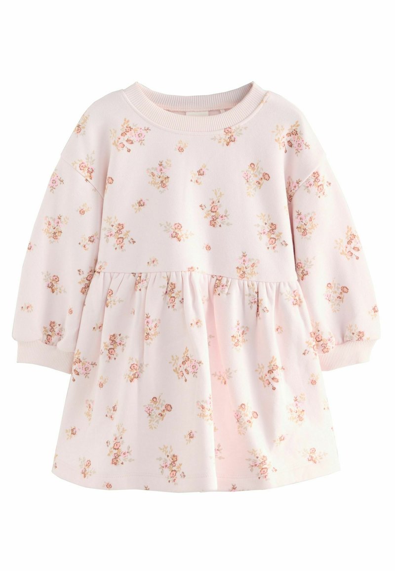 Robe rose clair avec des manches longues, taille froncée, imprimé floral dans des couleurs douces, et encolure et poignets côtelés. Fabriquée en tissu doux.