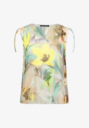 Blouse sans manches en tissu transparent avec imprimé floral style aquarelle en tons jaunes, verts et beiges, avec des détails noués sur les épaules.