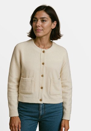Crème-kleurige cardigan met ronde halslijn, sluiting met knopen aan de voorkant, geribde manchetten en zoom, en twee opgestikte zakken. Zachte textuur, casual pasvorm.