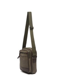 Kleine olijfgroene canvas schoudertas met verstelbare riem, voorvak met ritssluiting en leren rand aan de onderkant.