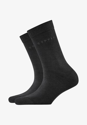 Chaussettes noires en coton avec une texture lisse et une bordure côtelée. Présente le logo subtil "ESPRIT" sur le côté. Design classique adapté à diverses occasions.