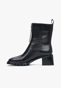 Black leather ankle boot with a square toe, sleek design, side zipper closure, and a chunky rubber sole with a ridged pattern.