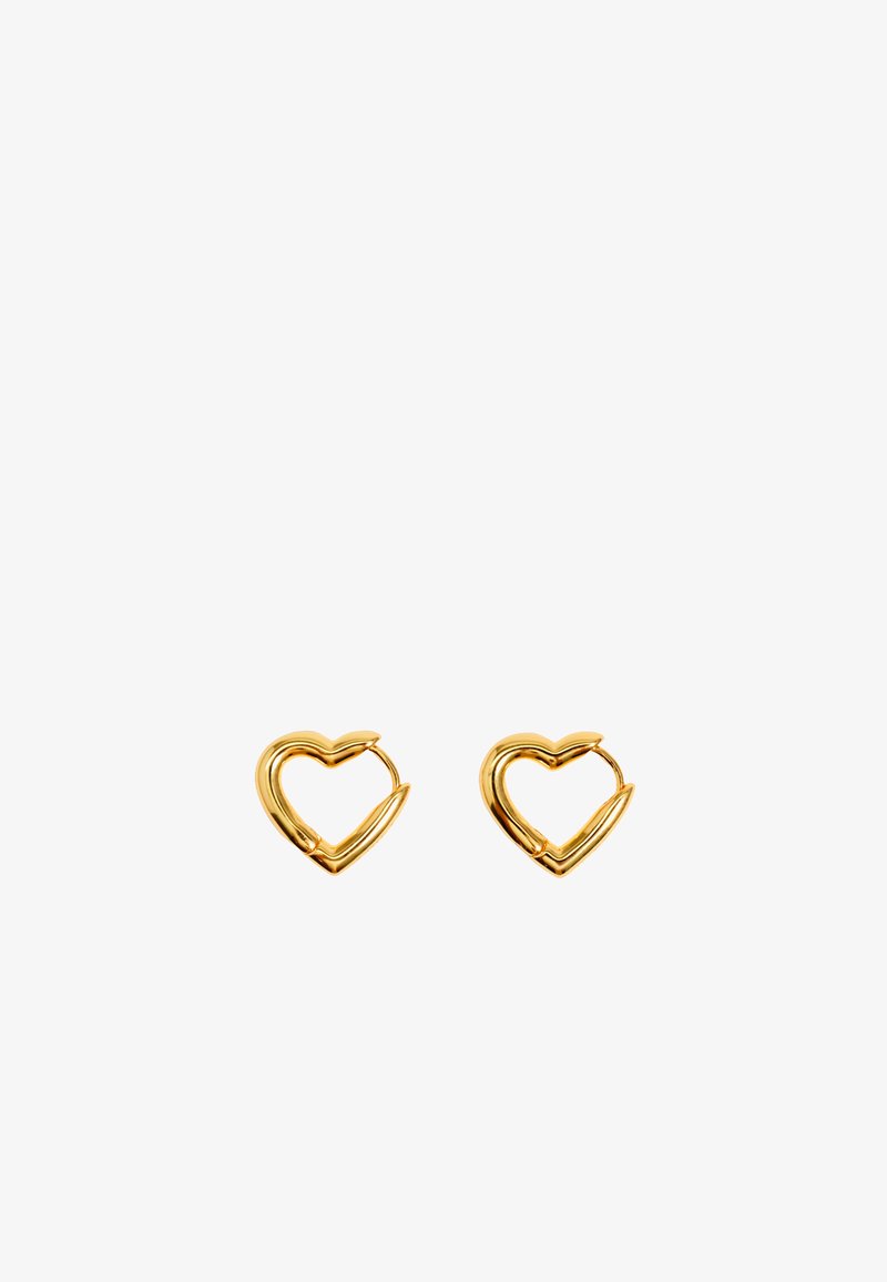Gold heart-shaped earrings with a smooth, polished finish and open design, featuring pointed accents increasing visual interest.