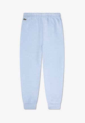 Světlomodré tepláky s elastickým pasem, žebrovanými manžetami a malým vyšívaným logem Lacoste na levé straně nad kolenem.