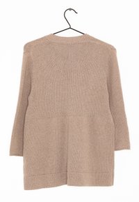 Beige stickad tröja med rund halsringning, långa ärmar och en något oversize passform. Har en strukturerad mönstring samt ribbade mudd och nederkant.