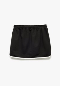 Zwarte rok van zacht materiaal met een elastische tailleband. Beschikt over witte accenten langs de onderzoom. Eenvoudige, ontspannen silhoutte.