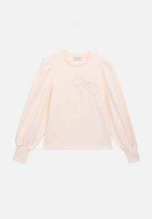 Lichtroze sweatshirt met lange, opgeblazen mouwen. Heeft een textuur met strikdesign en verspreide versieringen op de voorkant. Zacht materiaal.