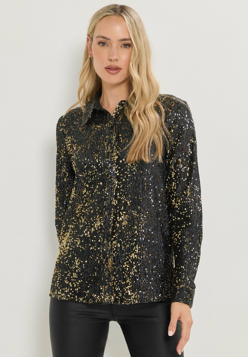 Camicia nera con paillettes, botton-down, maniche lunghe, con un motivo di paillettes dorate, colletto e un design a vestibilità dritta. Superficie texturizzata.