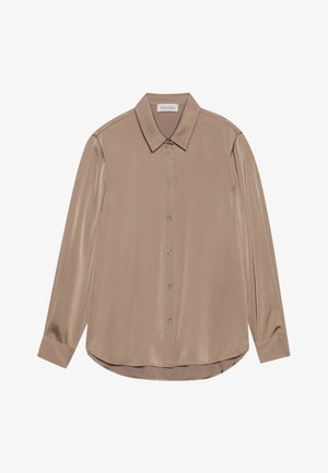 Μακριά μπλούζα με μακριά μανίκια σε μπεζ σατέν με μυτερό γιακά, μπροστινό κλείσιμο με κουμπιά και στρογγυλή γραμμή. Λείος υφασμάτινος χαρακτήρας και κομψή εφαρμογή.
