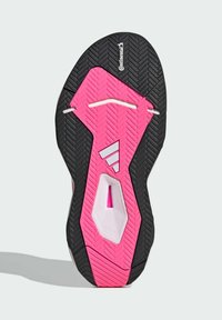 Podeszwa buta z czarną gumową podstawą, jasnoróżowym centralnym wzorem, teksturowaną powierzchnią i białymi akcentami. Widoczne logo "Continental".