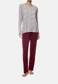 Light gray long-sleeved top with floral pattern; maroon, loose-fitting pants. Soft fabric with relaxed design, no visible hardware.