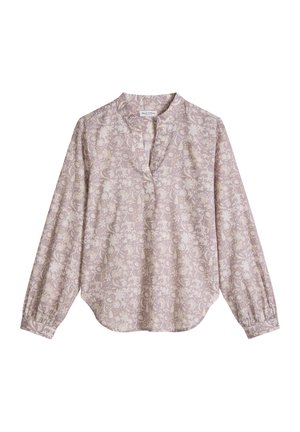 Długa bluzka z długim rękawem, jasnofioletowa, z subtelnym kwiatowym wzorem, dekoltem w kształcie litery V i marszczonymi mankietami, prezentowana na jednolitym białym tle.