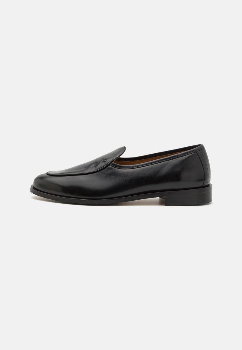 Black leather loafers with a smooth finish, rounded toe, low heel, and side slits for easy wear. Features a subtle logo detail on the front.