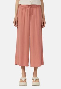 Lichtroze wijde broek met een elastische tailleband en een trekkoord. Glad textuur, volledige lengte en een ontspannen pasvorm.