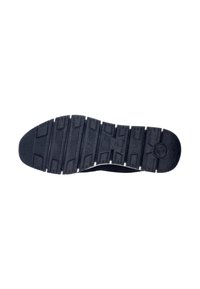 Semelle de chaussure en caoutchouc noir avec une surface texturée, présentant des crampons multidirectionnels pour une meilleure adhérence et une accentuation blanche le long du bord.