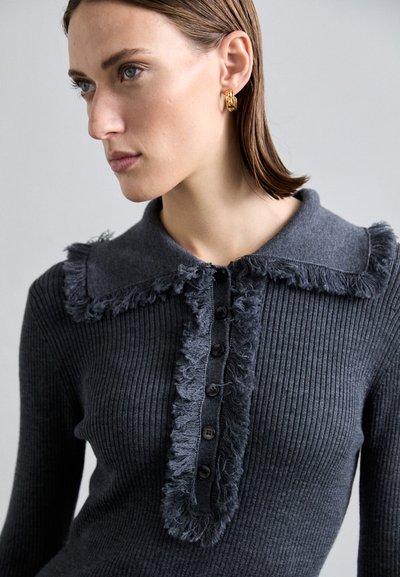 Dark grey knitted sweater with ribbed texture, frayed collar, and buttoned front placket featuring dark buttons.