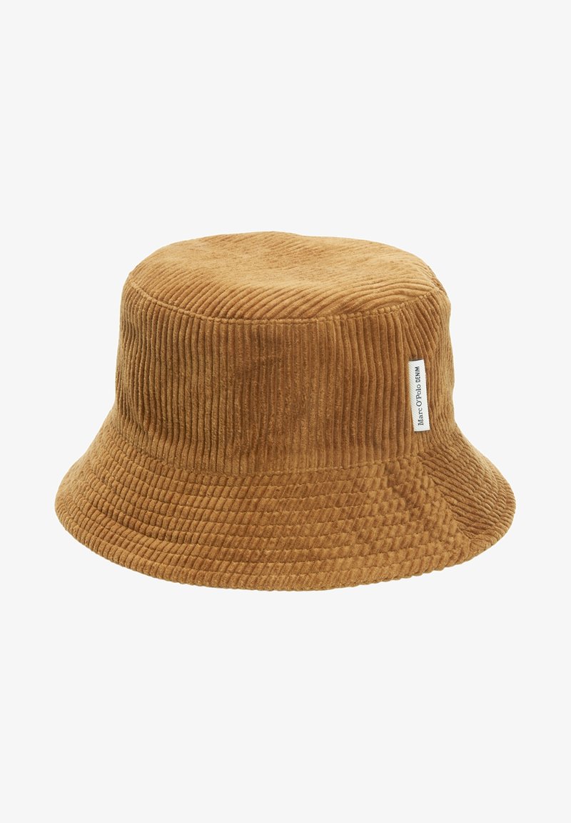 Chapeau bob en velours côtelé marron avec un large bord et une petite étiquette blanche sur le côté.