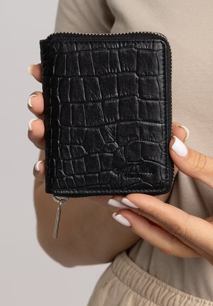 Black crocodile-embossed leather wallet with a zip closure and silver hardware, featuring a textured surface and compact square shape.