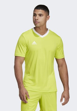 Neon gele sportshirt met een V-hals, korte mouwen en witte accenten. Bevat het Adidas-logo op de linkerkant van de borst. Glad textuur van de stof.