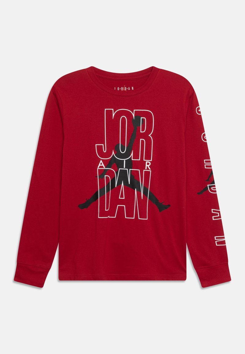 Red long-sleeve cotton t-shirt featuring a large black graphic design with the word "JORDAN" and an iconic silhouette on the front and sleeves.