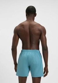BOSS ICONIC - Swimming shorts - light blue three