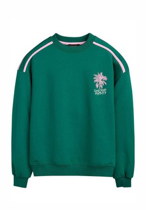 Sweat-shirt vert à col rond avec des rayures roses sur les épaules et un motif de palmier rose avec le texte "Teddy Smith Miami 89" sur la poitrine.