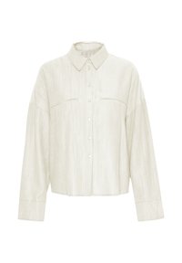 Lys beige skjorte med knapper lavet af ribbet stof, med krave, to brystlommer og lange ærmer med knapmanchetter.