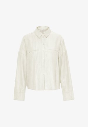 Helebeežist nööpidega särk, mis on valmistatud ribakangast, kaelusega, kahe rinna-taskuga ja pika varrukaga, millel on nööpidega mansetid.