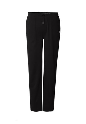 Pantalon de survêtement noir en tissu texturé, doté d'une taille ajustable avec cordon de serrage et d'un petit logo en accent.