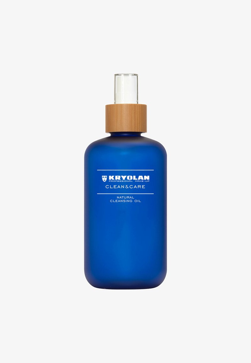 Blue glass bottle with a bamboo cap. White text label reads "KRYOLAN CLEAN&CARE NATURAL CLEANSING OIL." Smooth texture, rounded shape.