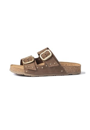 Brown suede slide sandal with cork sole, two large gold buckles, and small metal studs on straps.