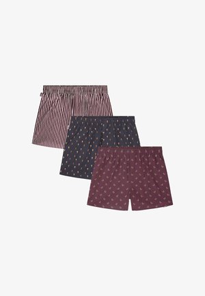 Tre paia di boxer: in alto a strisce rosse e bianche, al centro in blu navy con coni gelato, in basso in bordeaux con piccoli motivi floreali.