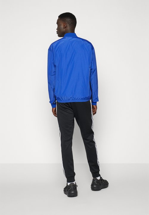 adidas Adicolor Classics SST Track Pants Black/White — foto 4