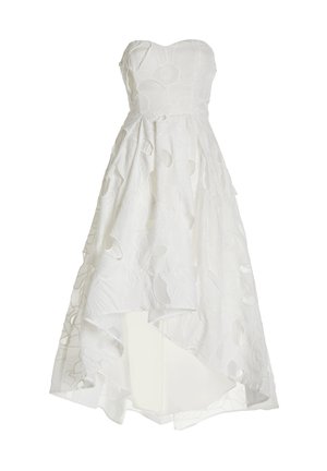 White strapless dress with floral 3D texture, asymmetrical hem, and layered design. Smooth fabric with subtle shine and cut-out details.