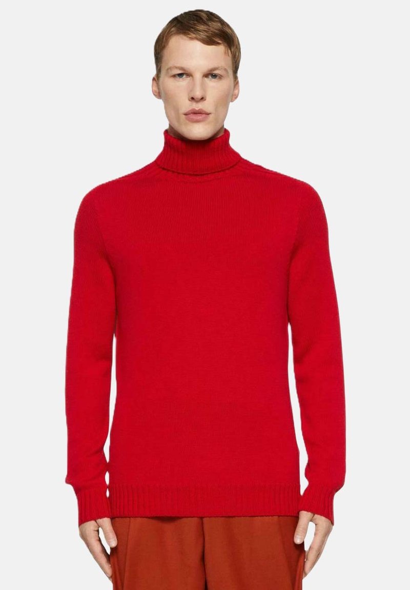 Maglione girocollo rosso realizzato in tessuto a coste. Presenta un design aderente, maniche lunghe e un collo alto.
