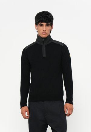 Black zip-neck sweater with long sleeves, featuring textured shoulder panels and a slim fit. Soft knit material, minimalistic design.
