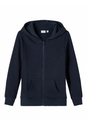 Jūras spēku zips kapuce, izgatavota no mīksta kokvilnas auduma, ar priekšējo rāvējslēdzēju, divām sānu kabatām un aukliņu kapuci.