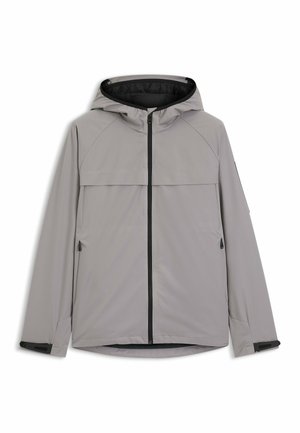 Hellgraue Kapuzenjacke mit schwarzem Reißverschluss vorne, seitlichen Reißverschlusstaschen und verstellbaren Handgelenkriemen, flach auf weißem Hintergrund dargestellt.